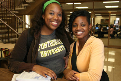 Two female students smiling.
